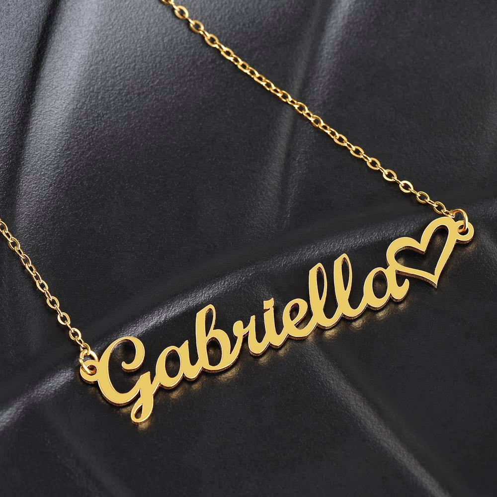 The name Gabriella in gold personalized name necklace with heart accent