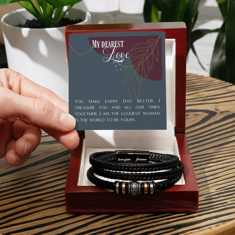Hand holding message card over Love Knot bracelet