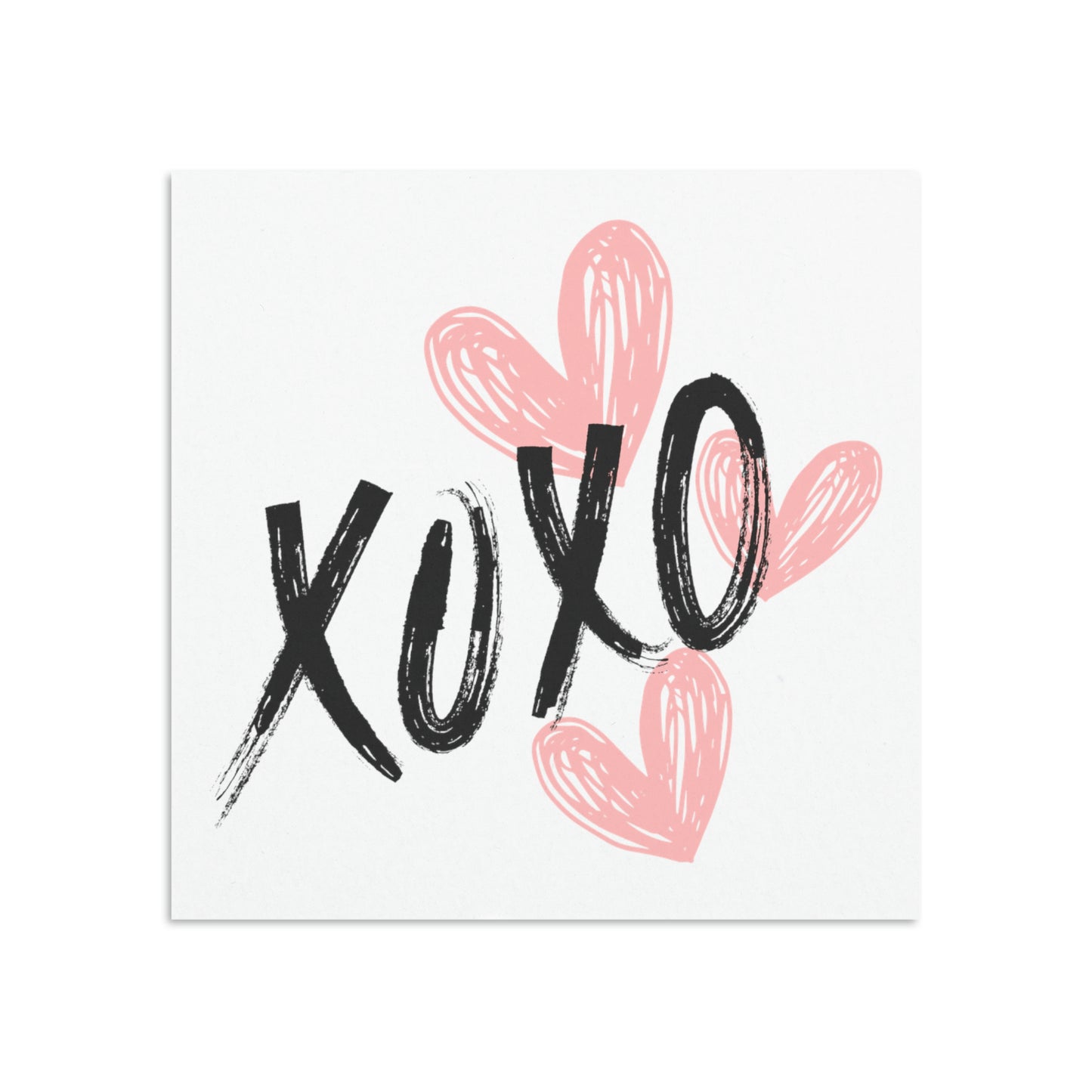 White message card featuring pink hearts and XOXO in black letters.