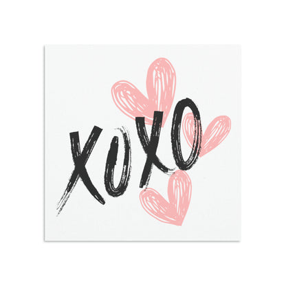 White message card featuring pink hearts and XOXO in black letters.