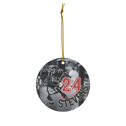 Ceramic ornament featuring black and white photo of football helmet and personalization example hanging in air.