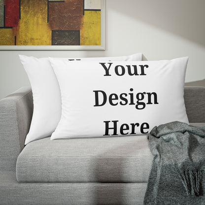 Two pillow cases on couch featuring “your design here”.