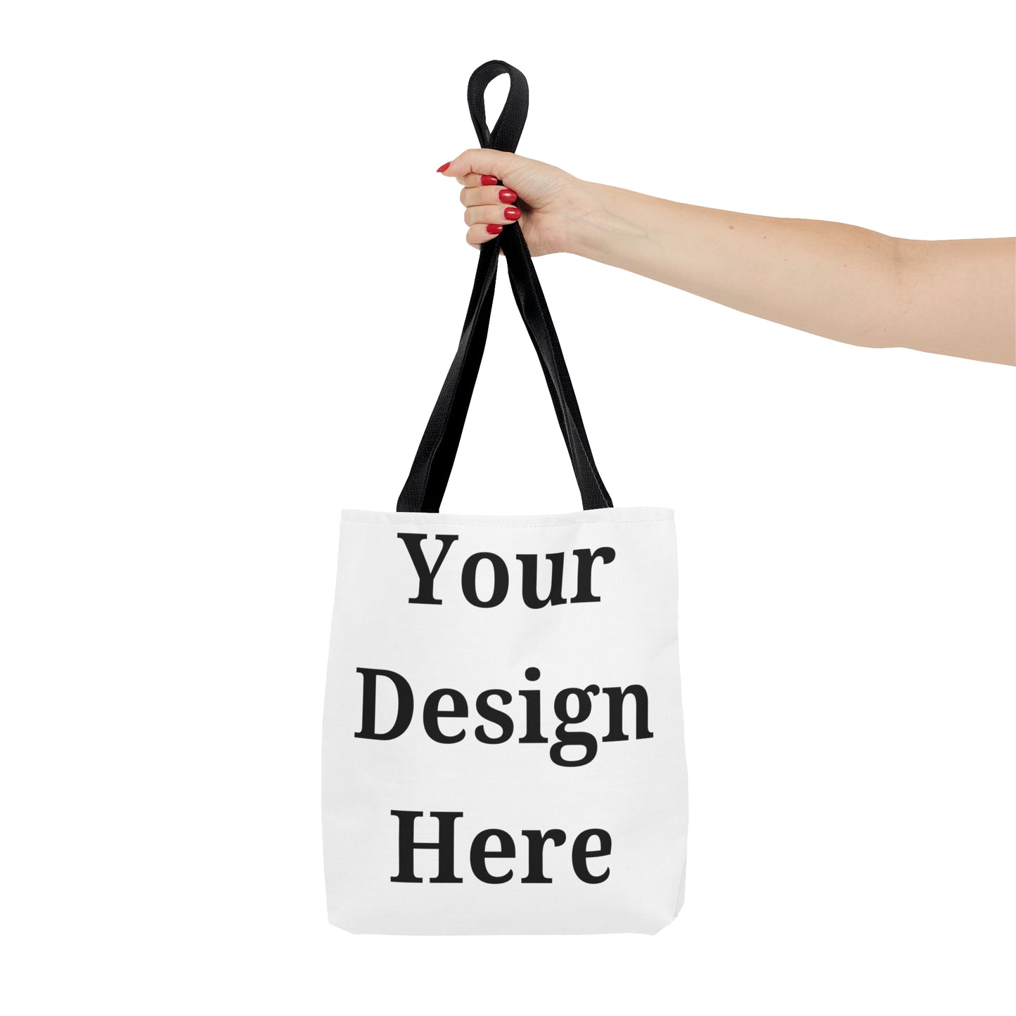 Person holding small tote bag featuring “your design here”.