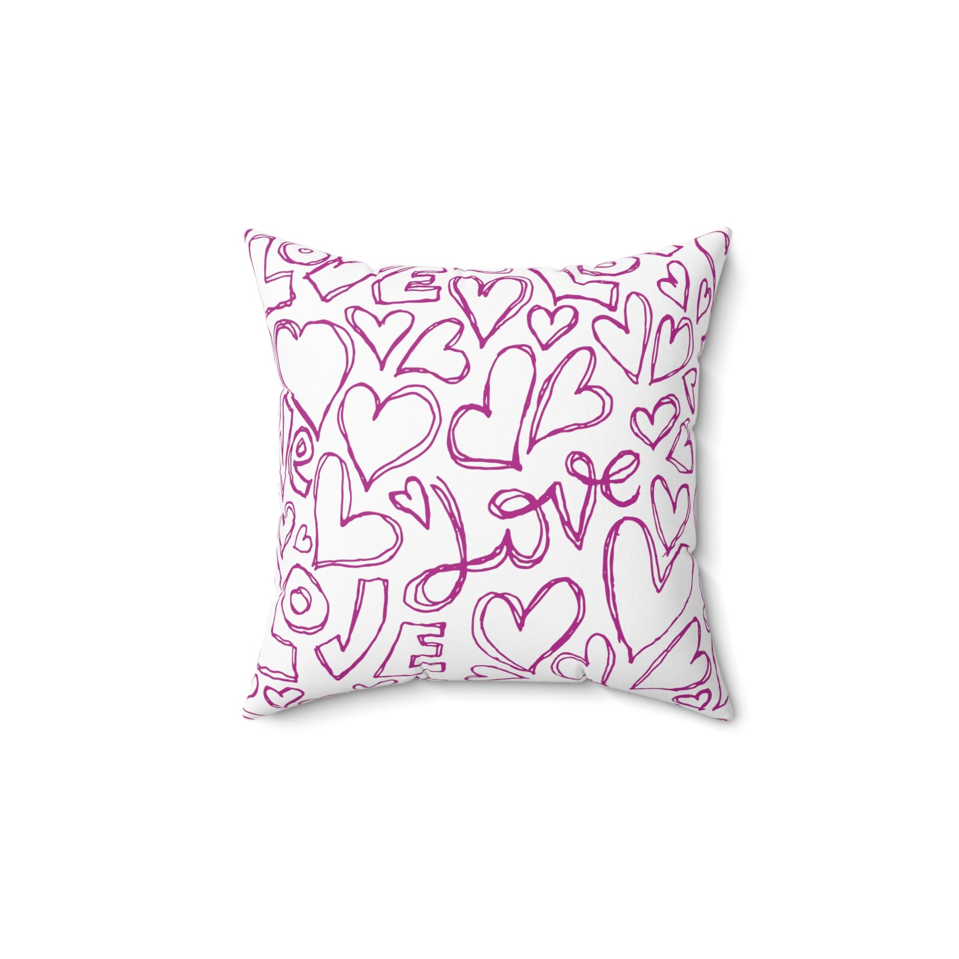 White throw pillow with the word Love and heart symbols scribed all over.