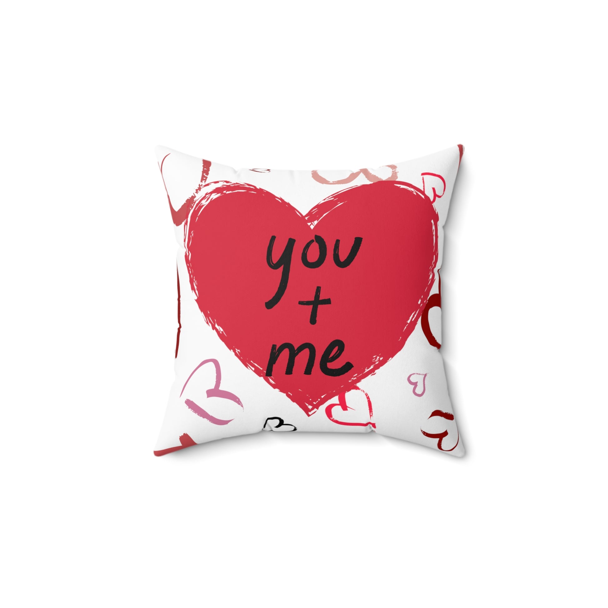 Pillow front showing the words “You + Me”.