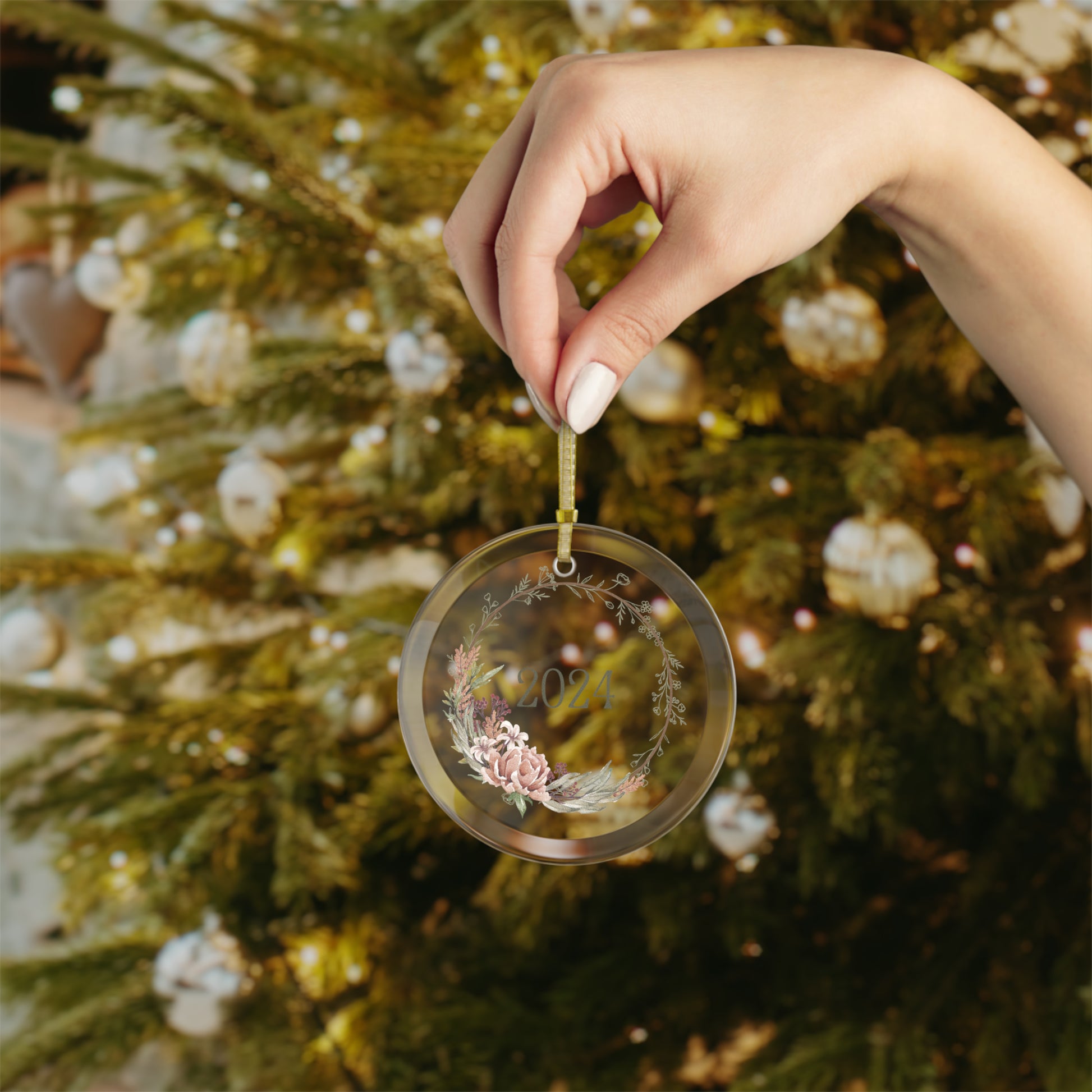 Hand holding Style 2 commemorative year ornament.