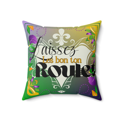 Front of pillow featuring French saying “Laissez les bon ton Roule”