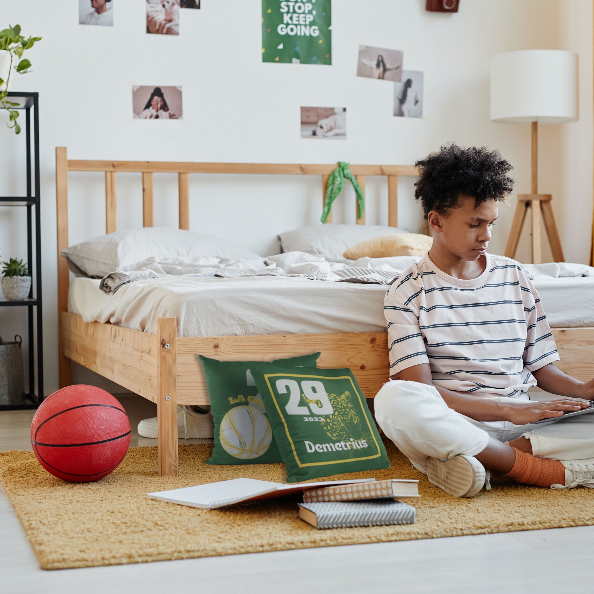 Boy sitting in room next to Basketball Throw Pillow Set