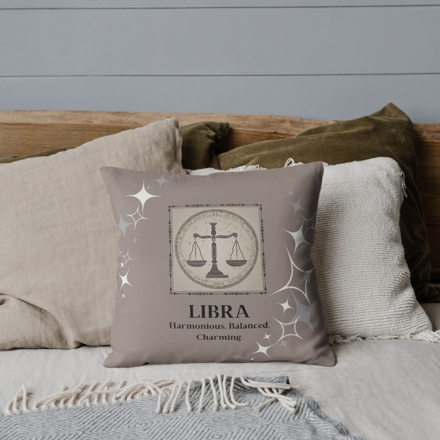 Libra Zodiac Throw Pillow on bed in Coffee Brown.