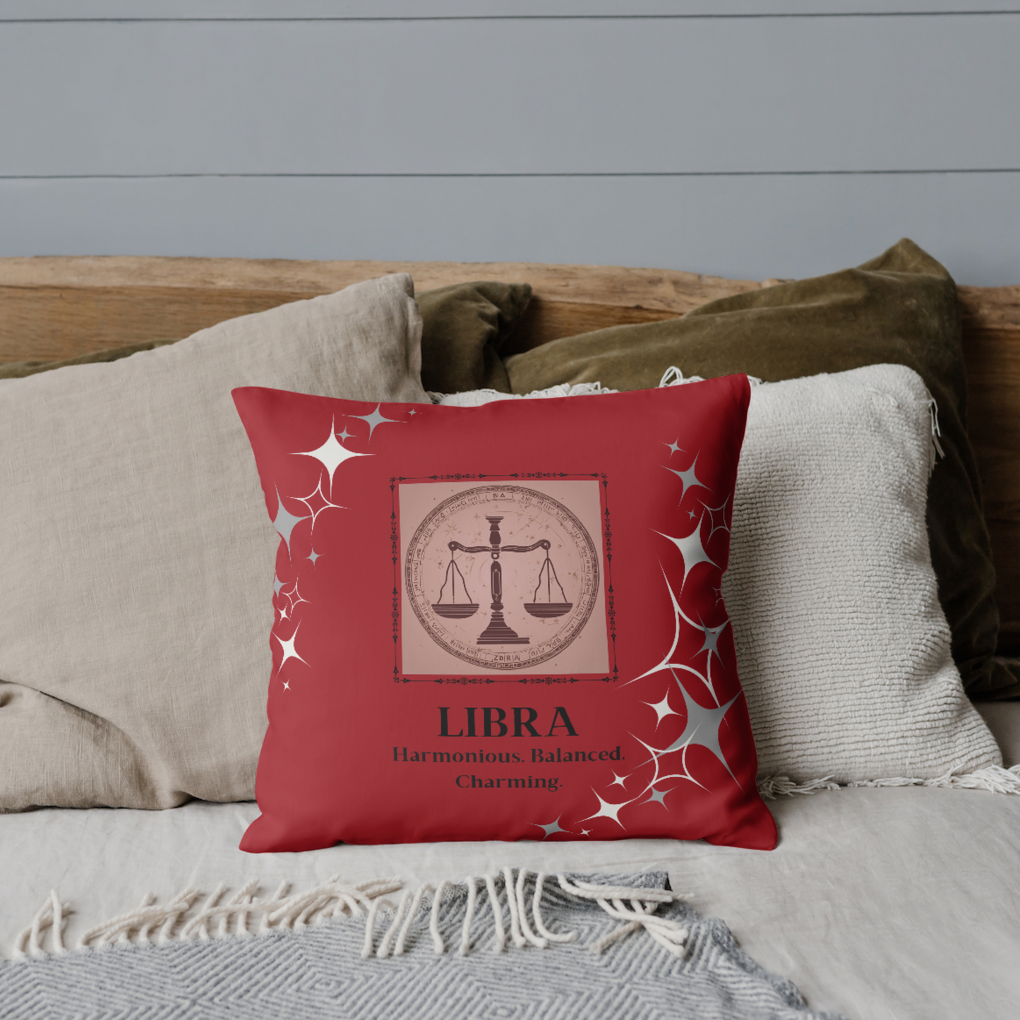 Leo Zodiac throw pillow on bed in Deep Red.