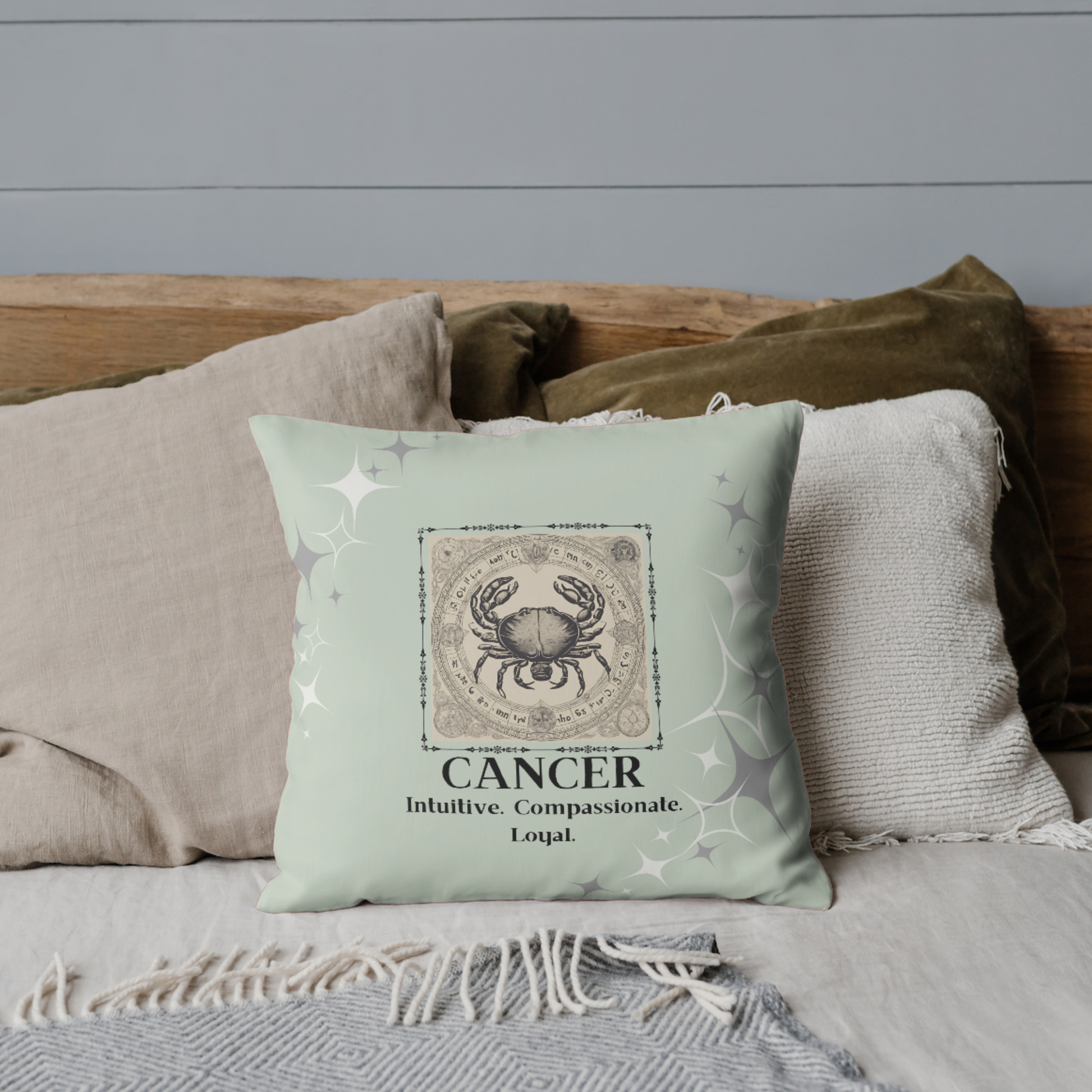 Zodiac throw pillow on bed on Spring Mint.