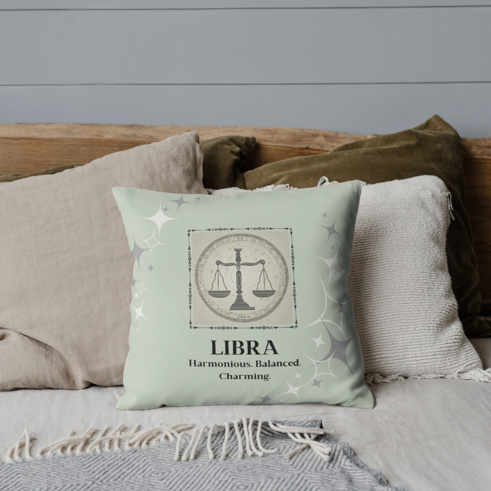 Libra Zodiac Throw Pillow on bed in Mint.