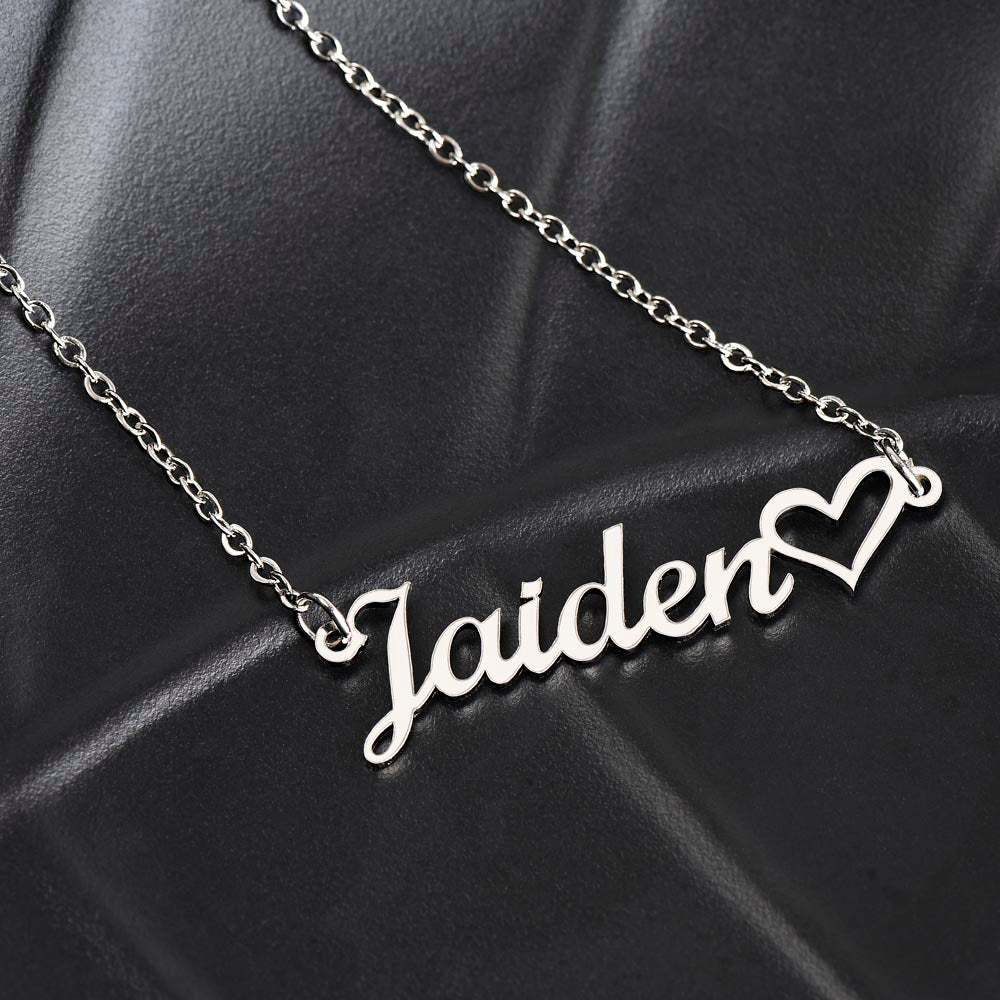 The name Jaiden in the silver personalized name necklace with heart accent.