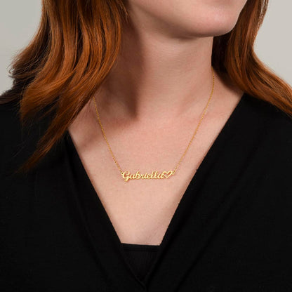 Woman wearing gold necklace featuring the name Gabriella.