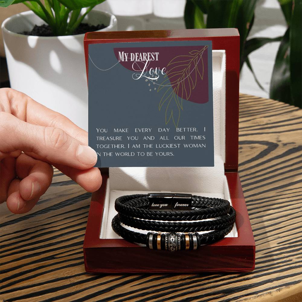 Hand holding message card over Love Knot bracelet 