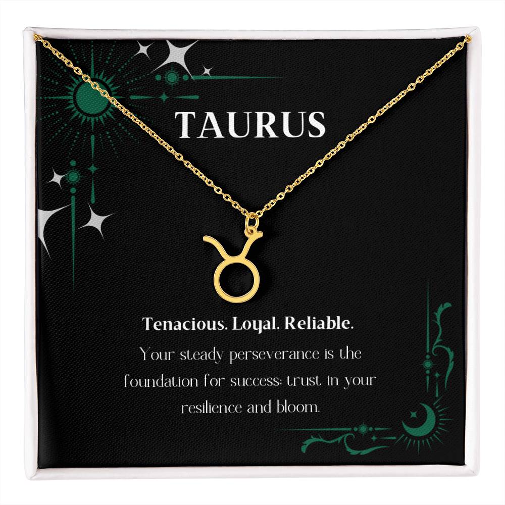 Gold Zodiac charm necklace in elegant black box, showcasing intricate astrological designs.