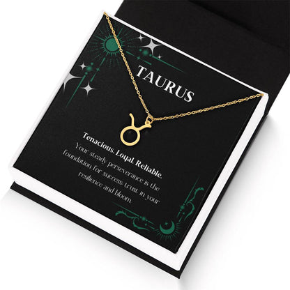 Gold Zodiac charm necklace in elegant black box, showcasing intricate astrological designs.