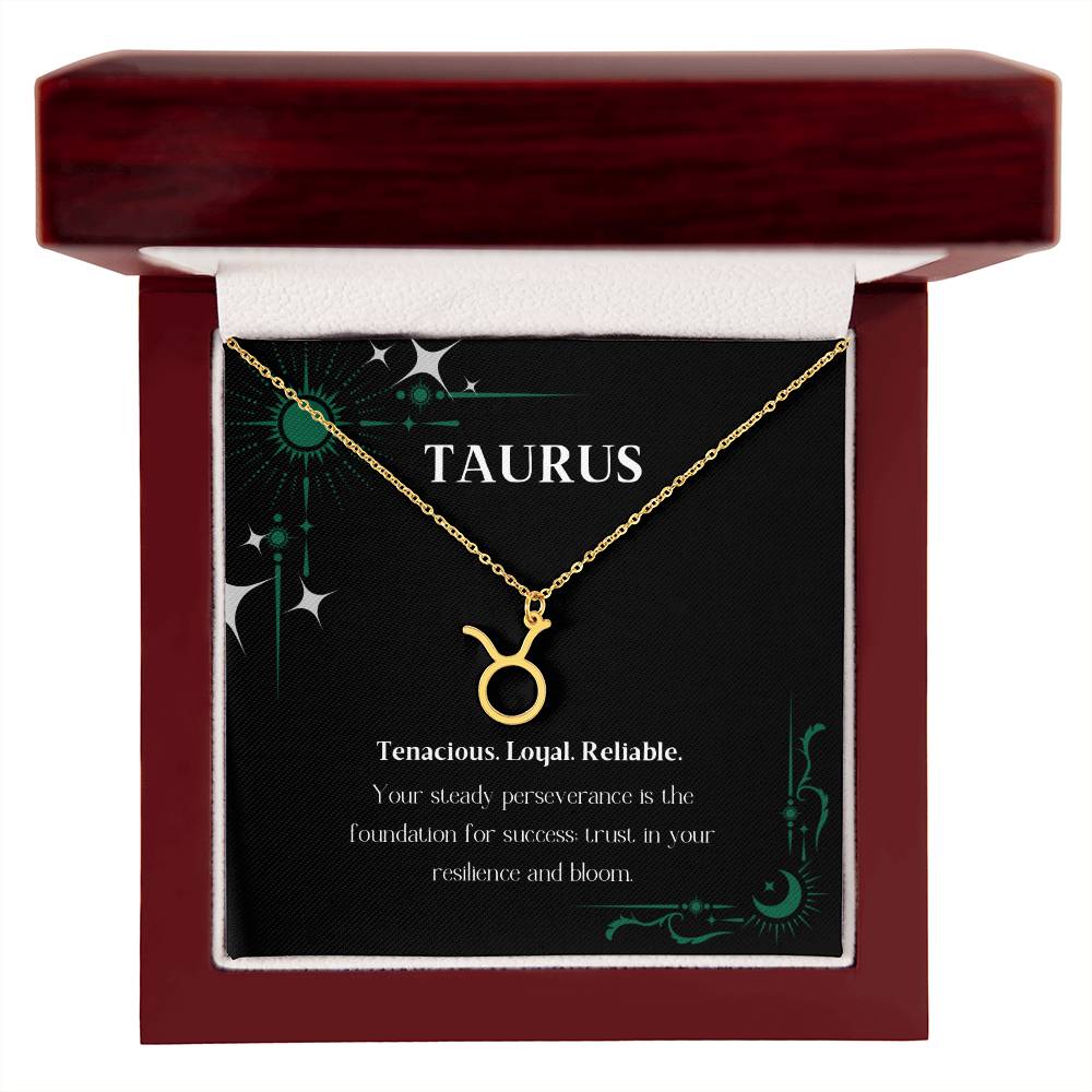 Gold Zodiac charm necklace in elegant mahogany box, showcasing intricate astrological designs.