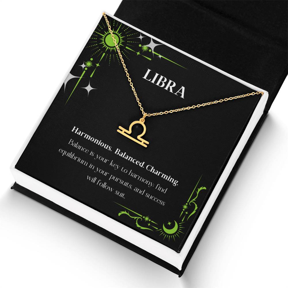 Gold Zodiac charm necklace in elegant black box, showcasing intricate astrological designs.