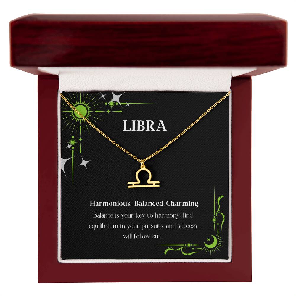 Gold Zodiac charm necklace in elegant mahogany box, showcasing intricate astrological designs.