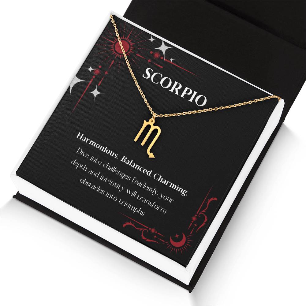 Gold Zodiac charm necklace in elegant black box, showcasing intricate astrological designs.