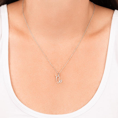 Woman wearing stainless steel zodiac charm necklace.