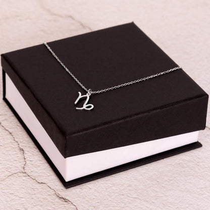 Stainless Steel Zodiac charm necklace on elegant black box.