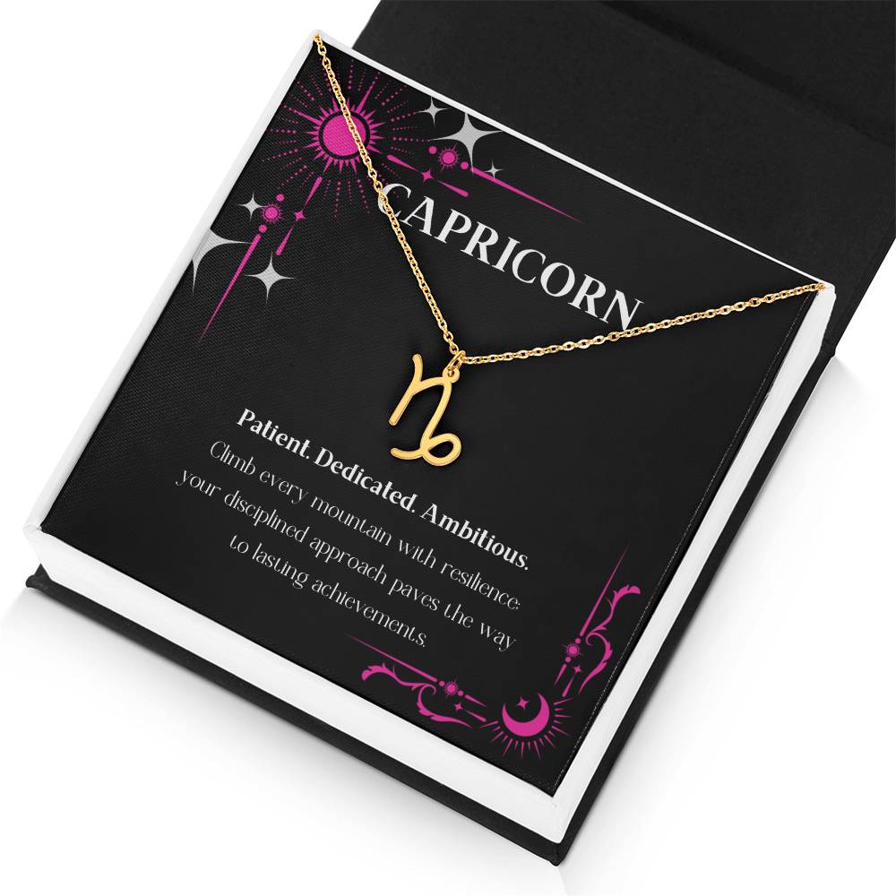 Gold Zodiac charm necklace in elegant black box, showcasing intricate astrological designs.