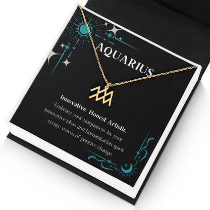 Gold Zodiac charm necklace in elegant black box, showcasing intricate astrological designs.