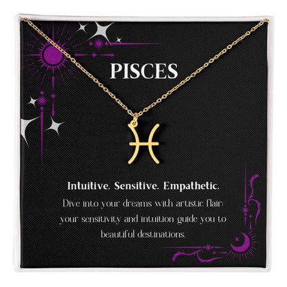 Gold Zodiac charm necklace laying on elegant black box.