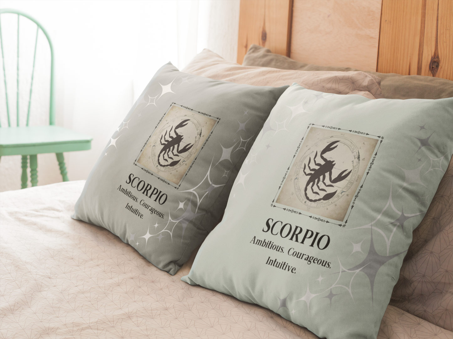 Scorpio Zodiac throw pillows in Mint and Smoke on bed.