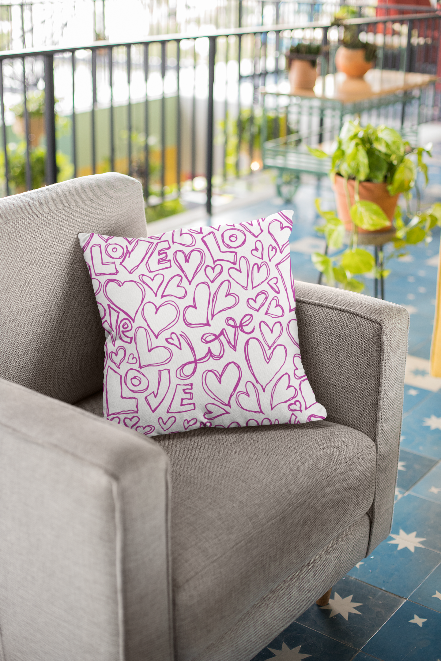 Love scribe throw pillow on accent chair.