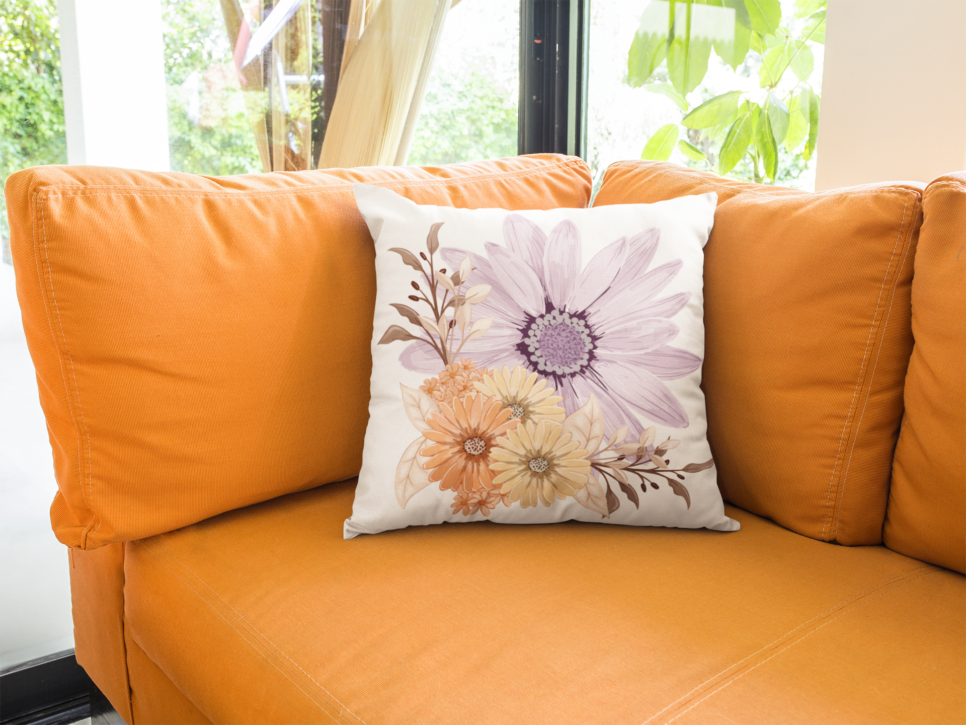 Bellissimi Fiori throw pillow on orange couch.